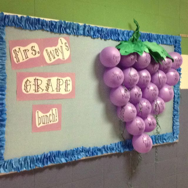 First day back to school bulletin board idea with colorful purple balloons 